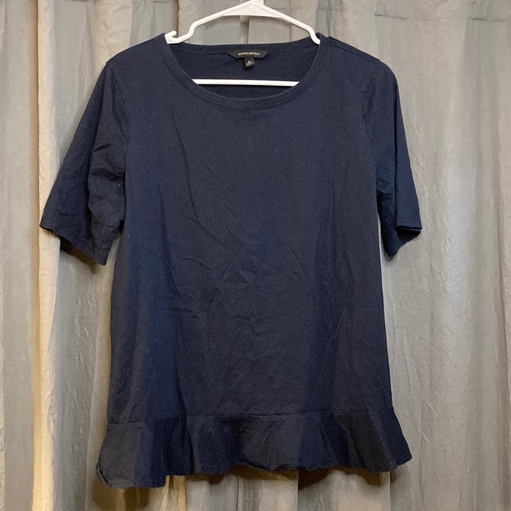 Navy blue ruffle goes around to the back side